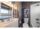 Bathroom featuring a vanity, decorative shelving, and a shower with white tile surround at 14554 90Th Ave, Seminole, FL 33776