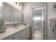 Stylish bathroom featuring a white vanity and a view into the walk-in shower area at 14554 90Th Ave, Seminole, FL 33776