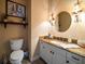 A cozy powder room with granite countertops and decorative lighting fixtures at 14554 90Th Ave, Seminole, FL 33776