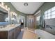 Luxurious bathroom offers a garden tub, glass enclosed shower, and a double vanity sink at 14554 90Th Ave, Seminole, FL 33776
