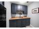 A charming coffee bar area with dark cabinets and a sink, perfect for entertaining at 14554 90Th Ave, Seminole, FL 33776