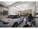 Attached garage with a compact car, motorcycle, and room for storage shelves at 14554 90Th Ave, Seminole, FL 33776