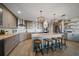 This spacious kitchen features a large island, stainless steel appliances, stylish lighting, and ample counter space at 14554 90Th Ave, Seminole, FL 33776