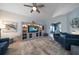 Comfortable living room featuring modern built-ins, plush sofas, and a ceiling fan at 14554 90Th Ave, Seminole, FL 33776