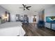 A spacious main bedroom showcases an ensuite bathroom, cool toned walls, and modern ceiling fan at 14554 90Th Ave, Seminole, FL 33776