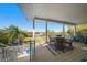 This large covered patio features outdoor dining and seating areas, providing an ideal space for relaxing and entertaining at 14554 90Th Ave, Seminole, FL 33776
