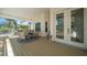 Inviting covered patio featuring a table and chairs for outdoor dining and relaxation at 14554 90Th Ave, Seminole, FL 33776