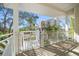 Covered porch with a lift overlooking the manicured yard and neighboring properties at 14554 90Th Ave, Seminole, FL 33776