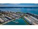 Aerial view of the coastal community highlighting the marina, beaches, and residential buildings at 3010 59Th S St # 303, Gulfport, FL 33707