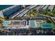 Aerial view showcases community amenities: pools, tennis courts, parking, and waterfront access at 3010 59Th S St # 303, Gulfport, FL 33707