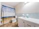 Bathroom with shower with seagull curtain, toilet and single sink at 3010 59Th S St # 303, Gulfport, FL 33707