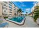 Private community pool with a lounge area and serene outdoor space in a waterfront location at 3010 59Th S St # 303, Gulfport, FL 33707