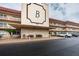 Exterior full view of condo building B, with visible parking and seating at 3010 59Th S St # 303, Gulfport, FL 33707