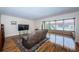 Living room with hardwood floors, fan and comfortable furnishings at 3010 59Th S St # 303, Gulfport, FL 33707