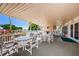 Outdoor patio with tables, seating, and view of the pool area at 3010 59Th S St # 303, Gulfport, FL 33707