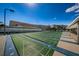 Well-maintained shuffleboard courts for leisure with seating and beautiful landscaping in the background at 3010 59Th S St # 303, Gulfport, FL 33707