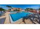 Outdoor swimming pool area with palm trees and lounge chairs at 3010 59Th S St # 303, Gulfport, FL 33707