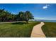 Scenic waterfront park area with grassy lawn, walkway, and seating at 3010 59Th S St # 303, Gulfport, FL 33707