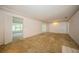 Expansive living room with carpet, awaiting transformation to match your personal taste at 322 Bahamas Ave, Temple Terrace, FL 33617