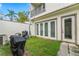Cozy outdoor space features a small grassy area, perfect for grilling and relaxing near French doors at 4142 N Nebraska Ave, Tampa, FL 33603