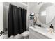 Bathroom with tub and shower combination with black shower curtain at 4142 N Nebraska Ave, Tampa, FL 33603