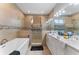 Modern bathroom with a soaking tub, walk-in shower, and double vanity at 4142 N Nebraska Ave, Tampa, FL 33603