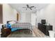 Cozy bedroom featuring light wood floors, recessed lighting, and ample closet space at 4142 N Nebraska Ave, Tampa, FL 33603