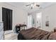 Comfortable bedroom with a ceiling fan, desk, and ensuite bathroom at 4142 N Nebraska Ave, Tampa, FL 33603