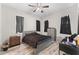Cozy bedroom featuring a ceiling fan, modern furniture and lots of natural light at 4142 N Nebraska Ave, Tampa, FL 33603