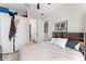 Cozy bedroom featuring a headboard with built-in shelving and an ensuite bathroom at 4142 N Nebraska Ave, Tampa, FL 33603