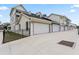 Row of attached garages showcases ample parking for residents and guests in a modern-styled community at 4142 N Nebraska Ave, Tampa, FL 33603