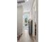 Hallway with hardwood floors and an exterior door that leads to a balcony at 4142 N Nebraska Ave, Tampa, FL 33603
