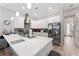 Bright kitchen with stainless steel appliances, white cabinets, and a large quartz countertop island, perfect for entertaining at 4142 N Nebraska Ave, Tampa, FL 33603