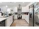 Spacious kitchen with white cabinets, stainless steel appliances, and modern countertops at 4142 N Nebraska Ave, Tampa, FL 33603