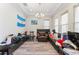 Living room with dark sofas and a chandelier at 4142 N Nebraska Ave, Tampa, FL 33603