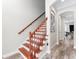 Elegant wooden staircase with a classic design and bright, neutral walls at 4142 N Nebraska Ave, Tampa, FL 33603
