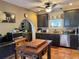 Rustic kitchen featuring dark cabinets, tile floors, and stainless steel appliances at 417 W Davis Blvd, Tampa, FL 33606