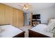 Relaxing bedroom featuring two daybeds, a television, and closet with wood doors at 4545 6Th N Ave, St Petersburg, FL 33713