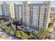 Overhead shot of the condo complex highlighting landscaping, a water feature, and residential tower at 750 N Tamiami Trl # 1203, Sarasota, FL 34236