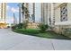 Renaissance building entrance with lush landscaping and prominent signage at 750 N Tamiami Trl # 1203, Sarasota, FL 34236