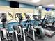 Well-equipped gym featuring modern cardio machines and large windows for natural light at 880 Mandalay Ave # S1014, Clearwater Beach, FL 33767