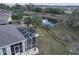 Aerial view of screened lanai and backyard, providing privacy and a tranquil setting at 920 Regal Manor Way, Sun City Center, FL 33573