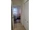 Light-filled bedroom with wood floors, a bed, and a chair, viewed from the hallway at 920 Regal Manor Way, Sun City Center, FL 33573
