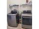 Modern laundry room with front loading washer and dryer at 920 Regal Manor Way, Sun City Center, FL 33573