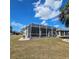 Lovely screened patio with view of the backyard of this beautiful home at 920 Regal Manor Way, Sun City Center, FL 33573