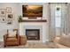 Cozy fireplace with a wooden mantel, tile surround, and decorative accents at 12515 Horseshoe Bend Dr, Lithia, FL 33547