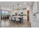 Bright kitchen with stainless steel appliances, pendant lighting, and island with bar stool seating at 12515 Horseshoe Bend Dr, Lithia, FL 33547