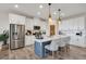 Beautiful kitchen features stainless steel appliances, island with seating, and white cabinetry at 12515 Horseshoe Bend Dr, Lithia, FL 33547