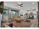 Spacious living room with an open floor plan, stylish furnishings, and outdoor access at 12515 Horseshoe Bend Dr, Lithia, FL 33547