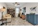 Comfortable living room featuring a built-in bookcase, a sofa, and a desk area at 12515 Horseshoe Bend Dr, Lithia, FL 33547